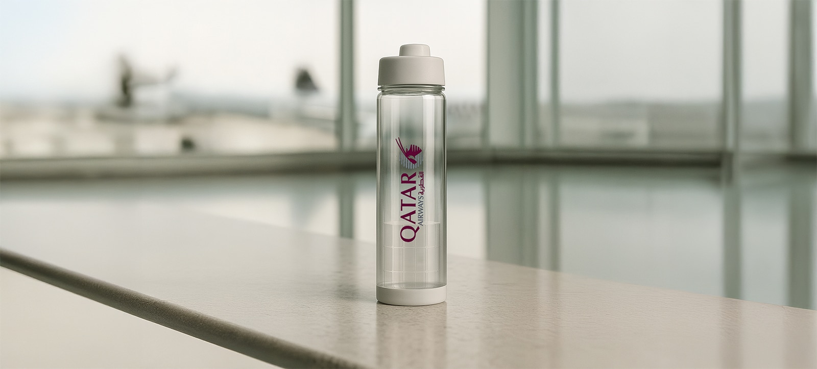 Qatar Airways branded water bottle at the airport
